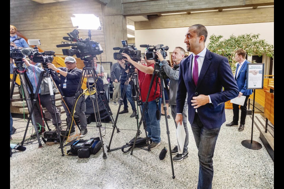 Ravi Kahlon, B.C. minister of housing, arrives for a news conference at Saanich Municipal Hall with Saanich Mayor Dean Murdock on Tuesday.  DARREN STONE, TIMES COLONIST 