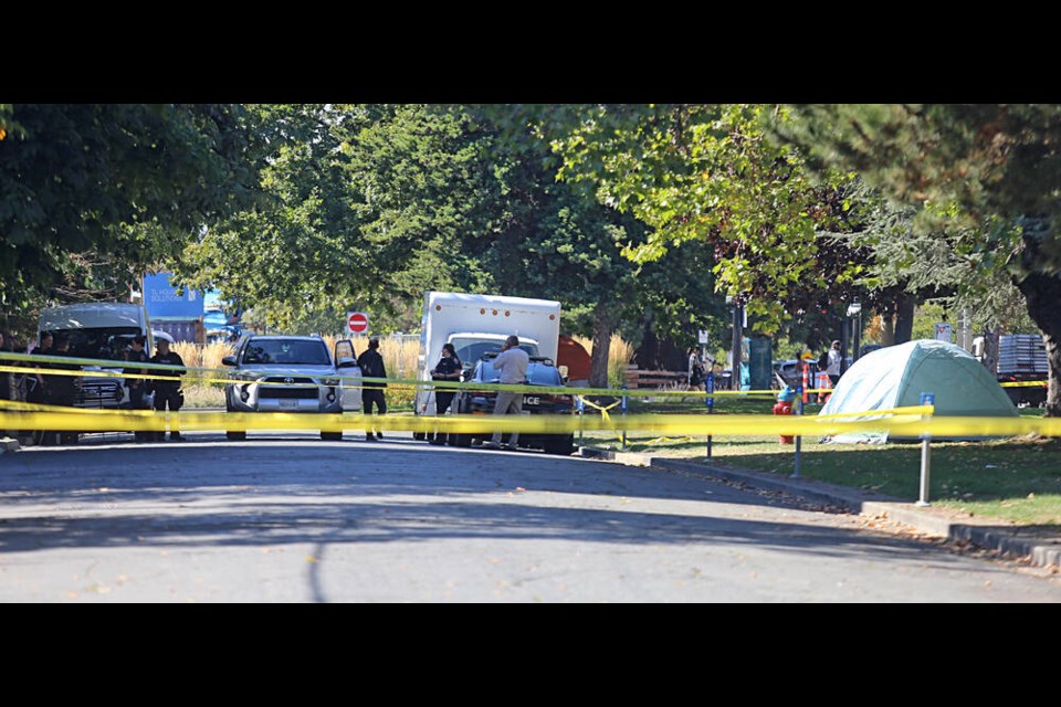 Police look for evidence after a death near the corner of Vancouver and Pandora streets early Thursday. ADRIAN LAM, TIMES COLONIST 