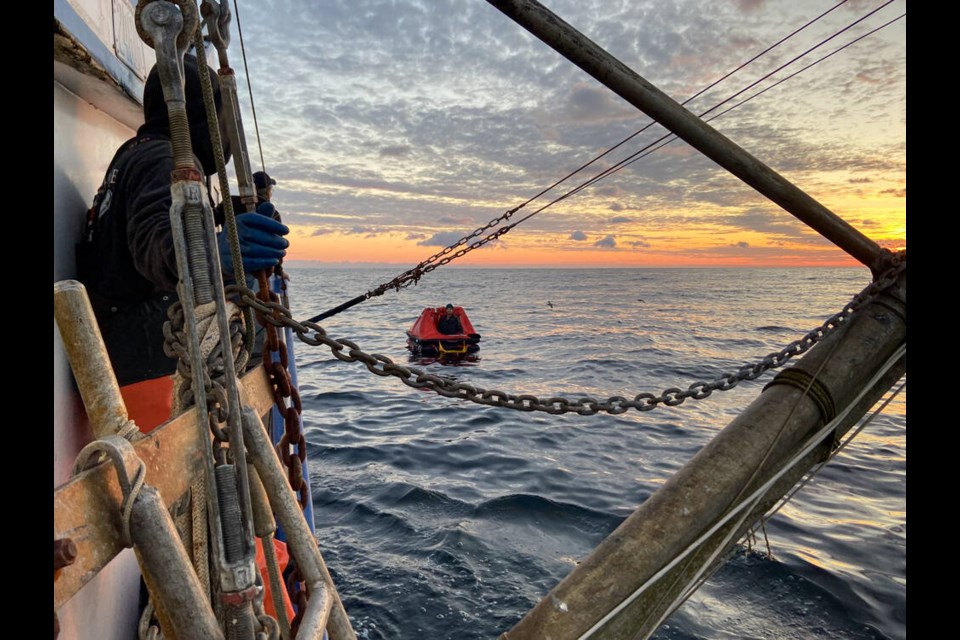 A life raft from the missing 13-metre Washington state-based vessel is shown in this handout image provided by the Canadian ship Ocean Sunset. Sharp-eyed mariners on the Canadian vessel have rescued a U.S. man, after the United States Coast Guard ended its search for a commercial fishing boat with two people aboard. THE CANADIAN PRESS/HO-Ocean Sunset 