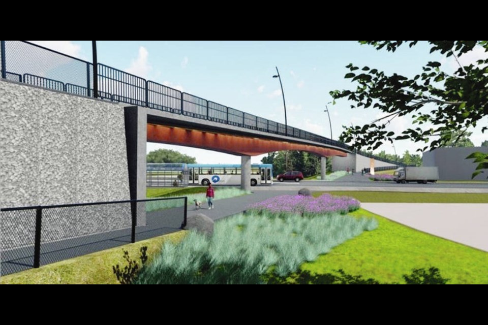 An artist’s rendering of the proposed bridge across the Island Highway. Colwood council has opted for enhanced underlighting, black-powder-coated fencing on the approach, post-tensioned cable fencing with a natural wood railing, and stamped concrete with a rock pattern. CITY OF COLWOOD 