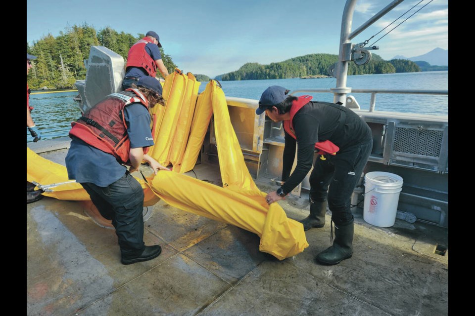 Guardian students learn about spill deployment equipment with the Canadian Coast Guard. VIA VANCOUVER ISLAND UNIVERSITY 