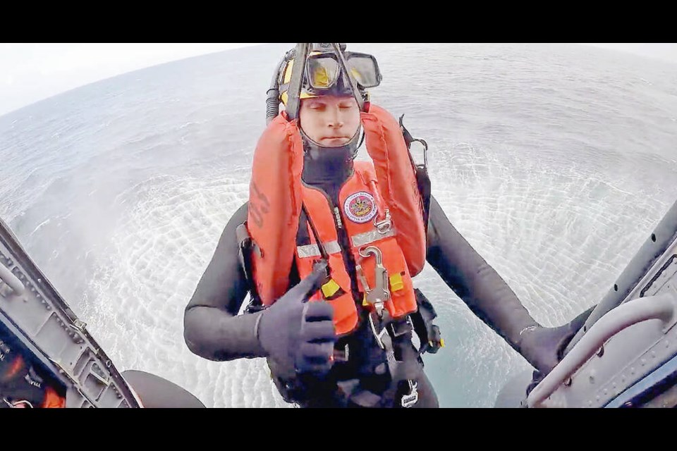 The two rescued Canadians were hoisted into the U.S. Coast Guard helicopter. Both men are in stable condition. VIA U.S. COAST GUARD 