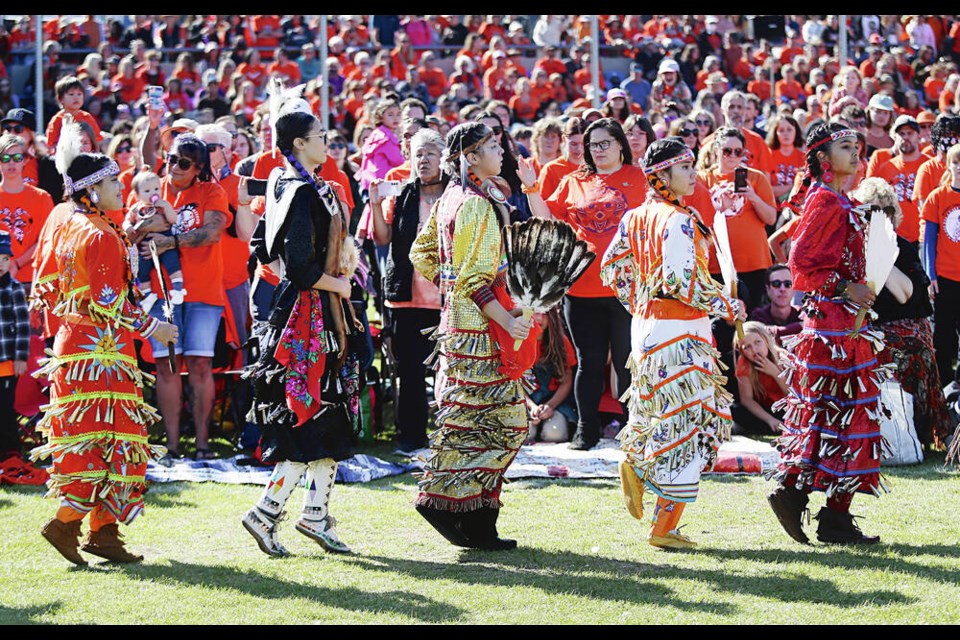 On the National Day for Truth and Reconciliation, Songhees Nation dancers take part in ceremonies at the annual South Island Powwow at Royal Athletic Park in Victoria on Saturday. ADRIAN LAM, TIMES COLONIST 