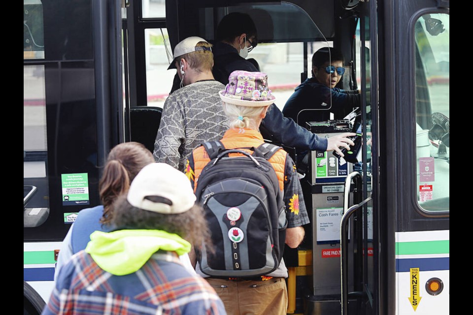 Riders use the new Umo fare-payment system as they board a B.C. Transit bus at the University of Victoria. 
ADRIAN LAM, TIMES COLONIST 