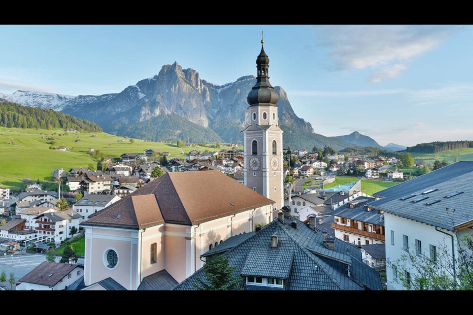 Church tower in Castelrotto / Kastelruth, Dolomites In Kastelruth, the church bells rouse sleepers at 6 a.m.  to the comfort of locals and to the consternation of tourists. (photo: Cameron Hewitt) 