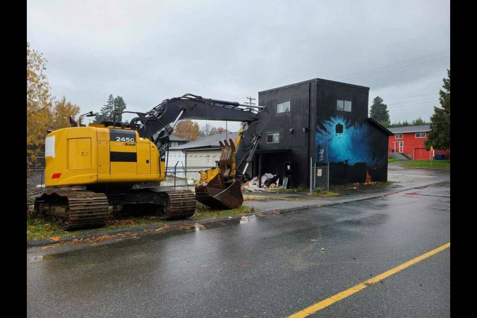 Heavy equipment moves in on Wednesday to start demolishing the former Hells Angels clubhouse. Submitted 