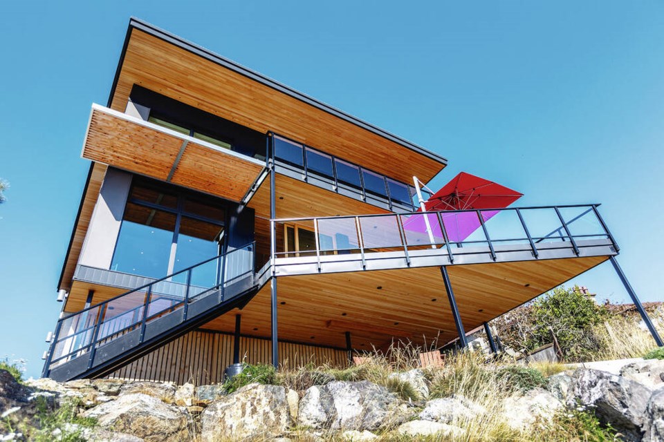 The front of the house has a triangular deck on the second level, which is reminiscent of the prow of a boat. DARREN STONE, TIMES COLONIST 