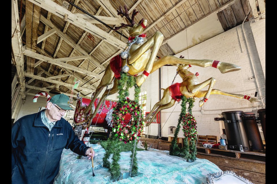 Jim Sturgill Sr. works on the Santa’s sleigh float at the Bayview Roundhouse for Saturday’s 41st Peninsula Co-op Santa Claus Parade. DARREN STONE, TIMES COLONIST 