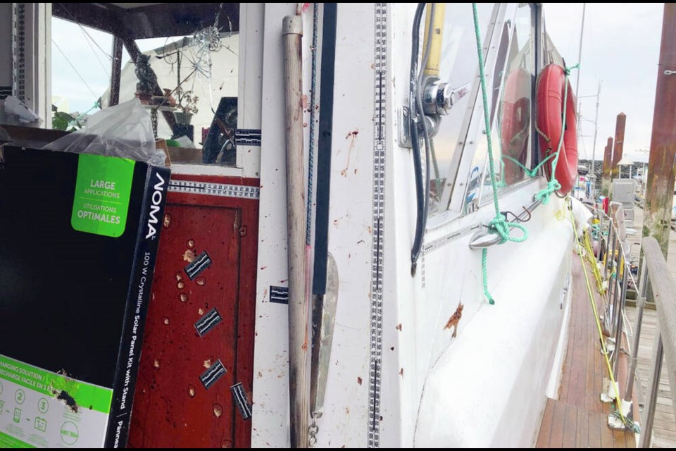 Bullet holes and broken glass mar the boat after the incident. KENDALL HANSON, CHEK NEWS 