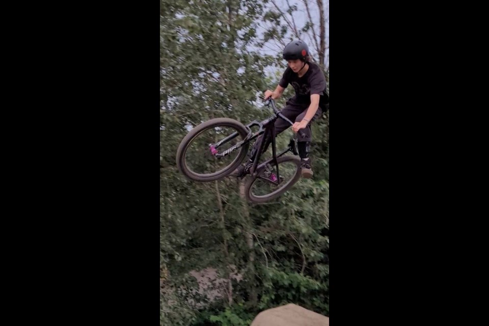Parker Amann riding his bike. Parker, 14, died Dec. 28, 2023, when the lawnmower he was riding collided with a pickup truck in Cedar. PAUL AMANN VIA FACEBOOK 