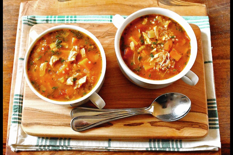 Hearty turkey soup is rich with quinoa, yams and other vegetables.  ERIC AKIS