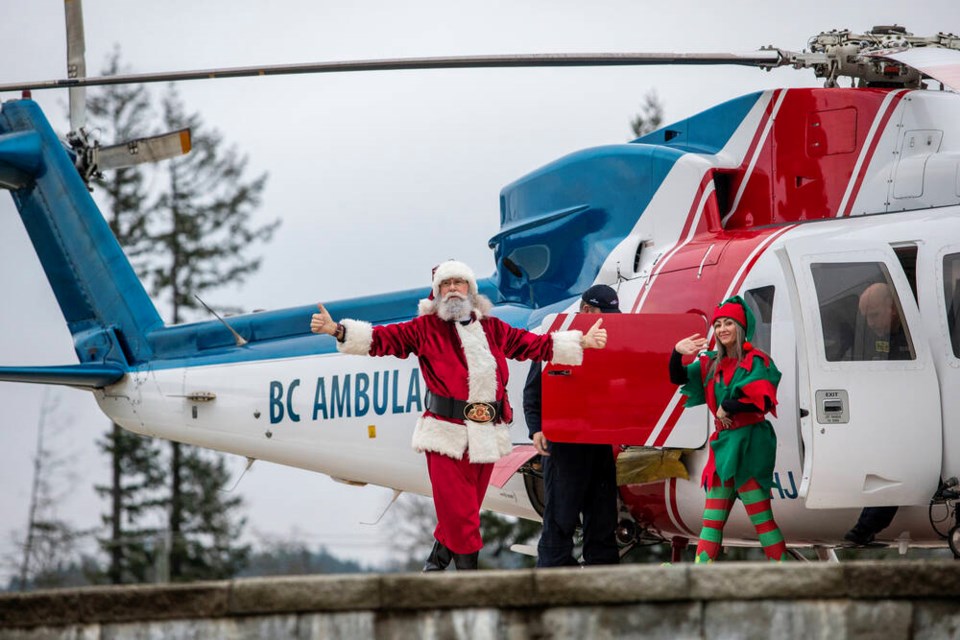 Santa Claus and his entourage from BCEHS and Helijet arrive at Victoria General Hospital on a tour of pediatric units at Vancouver Island and Lower Mainland hospitals on Tuesday. DARREN STONE, TIMES COLONIST 
