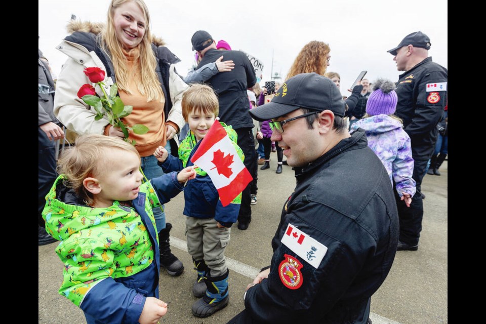 Petty Officer 2nd class T.J. Goodhew is greeted by wife Haley Goodhew, Milo Goodhew, 5, and Harland Goodhew, 3, on Monday as HMCS Ottawa returns to CFB Esquimalt after 126 days away. DARREN STONE, TIMES COLONIST 