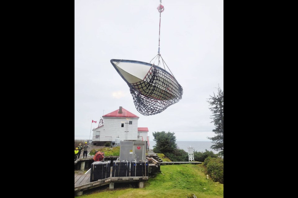 A new boat is delivered to Ivory Island light station, about 35 kilometres northwest of Bella Bella at Seaforth Channel and Milbanke Sound. The helicopters often take out trash and recycling on their way out. CANADIAN COAST GUARD 