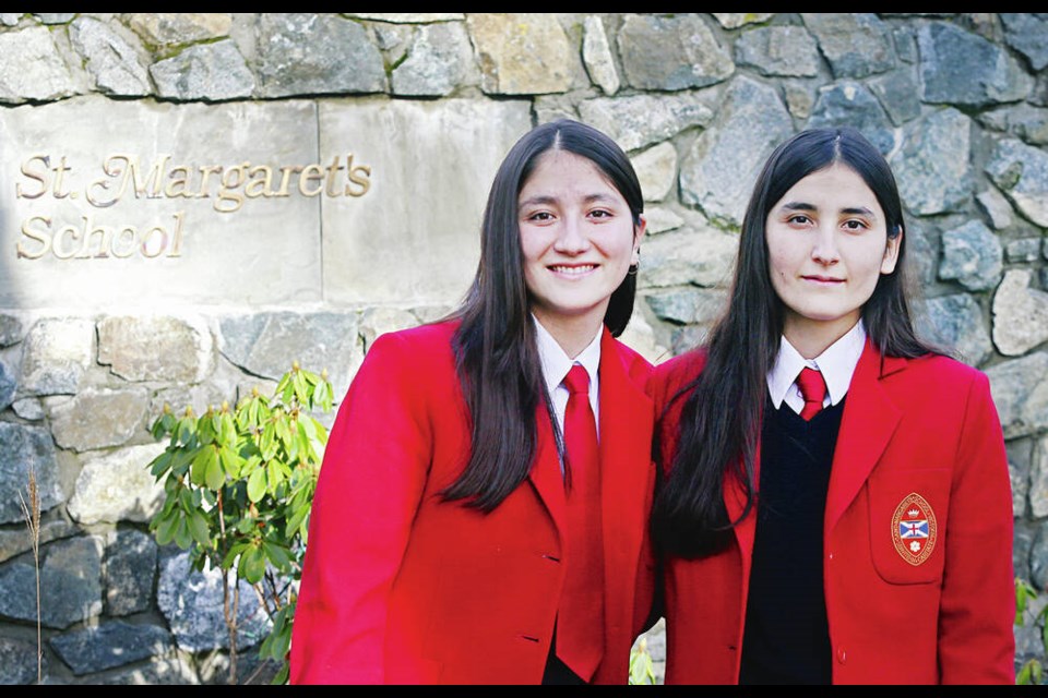 Sisters Zarmina, 18, left, and Torpikai Sultani, 20, came from Afghanistan to attend St. Margaret’s School in Saanich.	ADRIAN LAM, TIMES COLONIST 