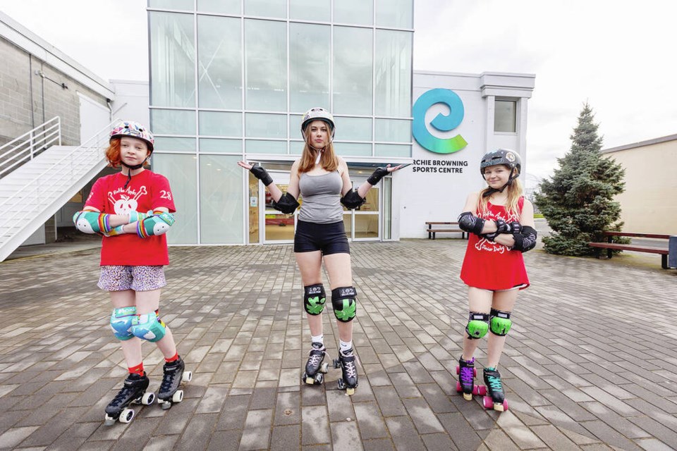VICTORIA, B.C.: JANUARY 30/2024-Rotten Apples junior roller derby team members, left to right, “Apple Smack” Olivia K-E,12, “Pearl Jam” Pearl Stewart,14, and “Pink Lightning” Lily-Rose Labelle,12 at the Archie Browning Sports Centre   in  Victoria, B.C. January 30, 2024. (DARREN STONE, TIMES COLONIST). For City story by Michael John Lo.