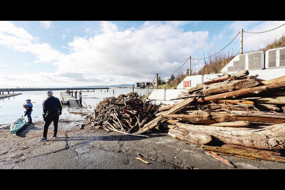 Storm debris is seen at the Esquimalt Anglers Association boat launch on Wednesday. Crews across the capital region were clearing up after Tuesday’s powerful windstorm. DARREN STONE, TIMES COLONIST 