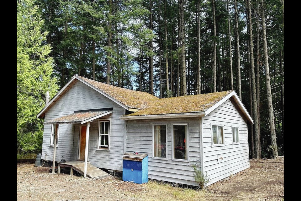 The house before the renovation. The old residence on school property had morphed 
into a storage facility and workshop over the years.  