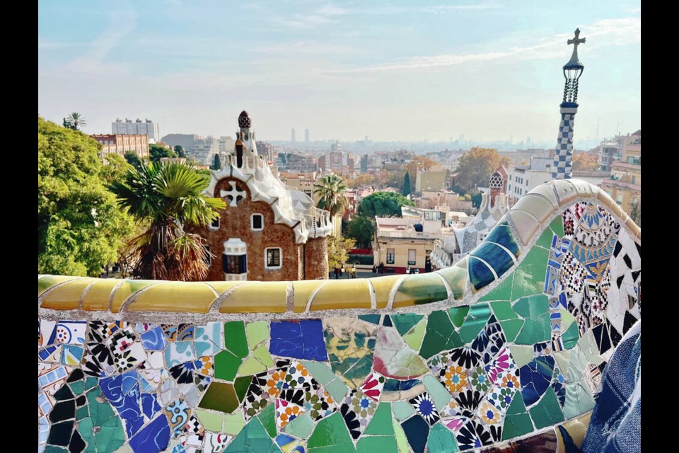 A mosic curving park bench overlooks the main entrance to Park Guell, an urban development designed by Gaudi, whose building work began in 1900 and ended in 1914. KIM PEMBERTON 