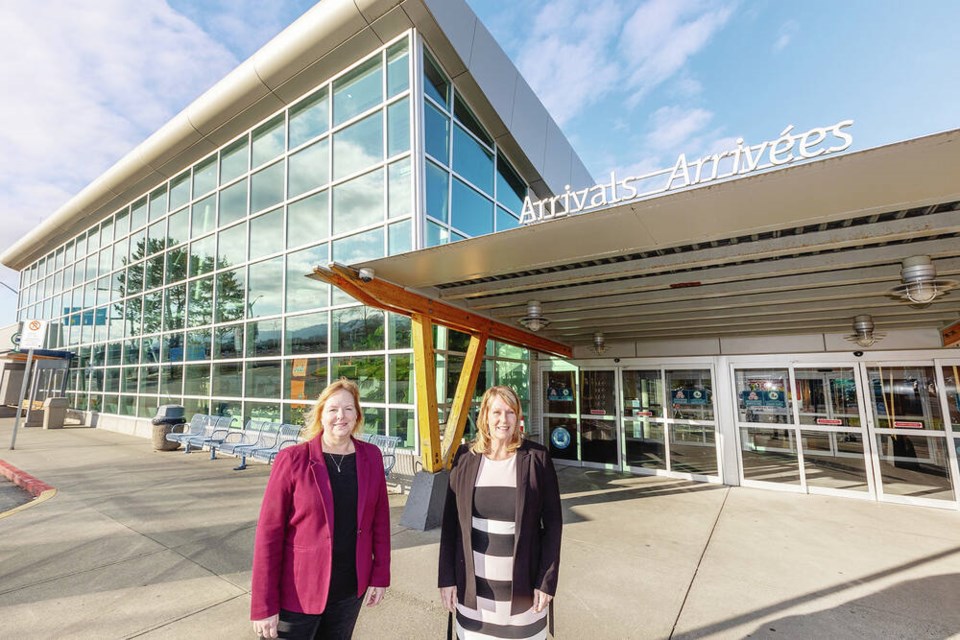 Cathie Ounsted, chair of the Victoria Airport Authority board of directors, left, and CEO Elizabeth Brown at the Victoria International Airport arrival area. DARREN STONE, TIMES COLONIST 
