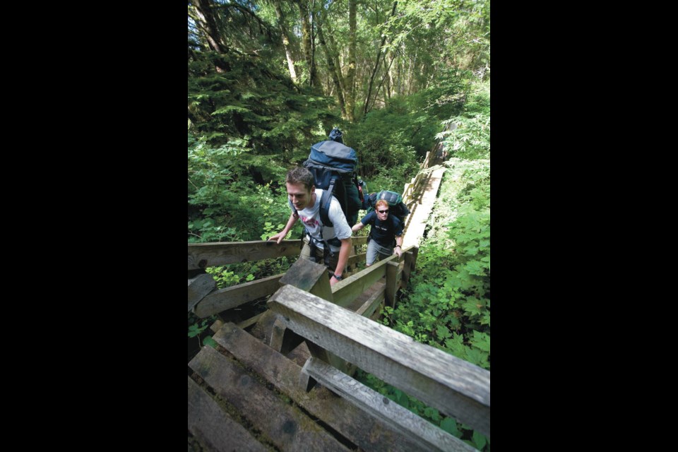 John Vroegop of Chilliwack and Graham Slot of Burnaby start out on the West Coast Trail in ­Bamfield on Aug. 14, 2007. DARREN STONE, TIMES COLONIST 