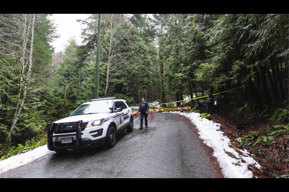 Police block the road in the 3100-block of Humpback Road on Jan. 21, 2020. DARREN STONE, TIMES COLONIST 