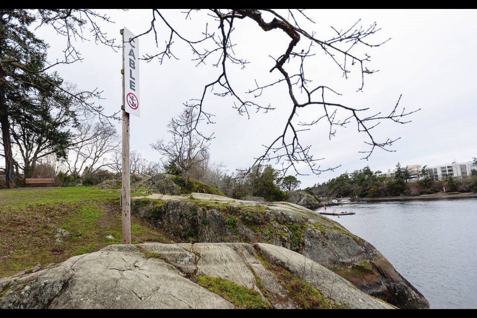 A sign in Banfield Park in Vic West indicates the presence of a B.C. Hydro underground transmission cable. DARREN STONE, TIMES COLONIST 