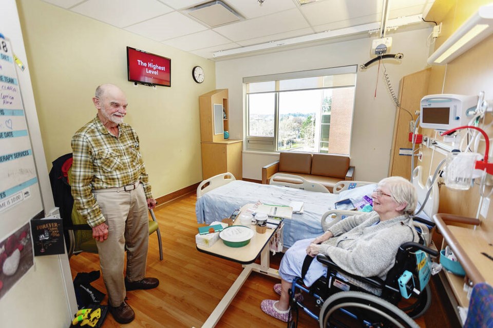 Denis Moffatt and Diane (Elizabeth) Moffatt with the new television in the Royal Jubilee Hospital Patient Care Centre. DARREN STONE, TIMES COLONIST 