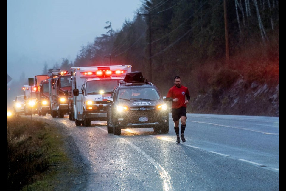 Sgt. Rob Brennan of Comox Valley RCMP running along Highway 19 on Sunday morning. VIA JOHN W. PENNER/JOHN’S PHOTOGRAPHY Feb. 25, 2024 