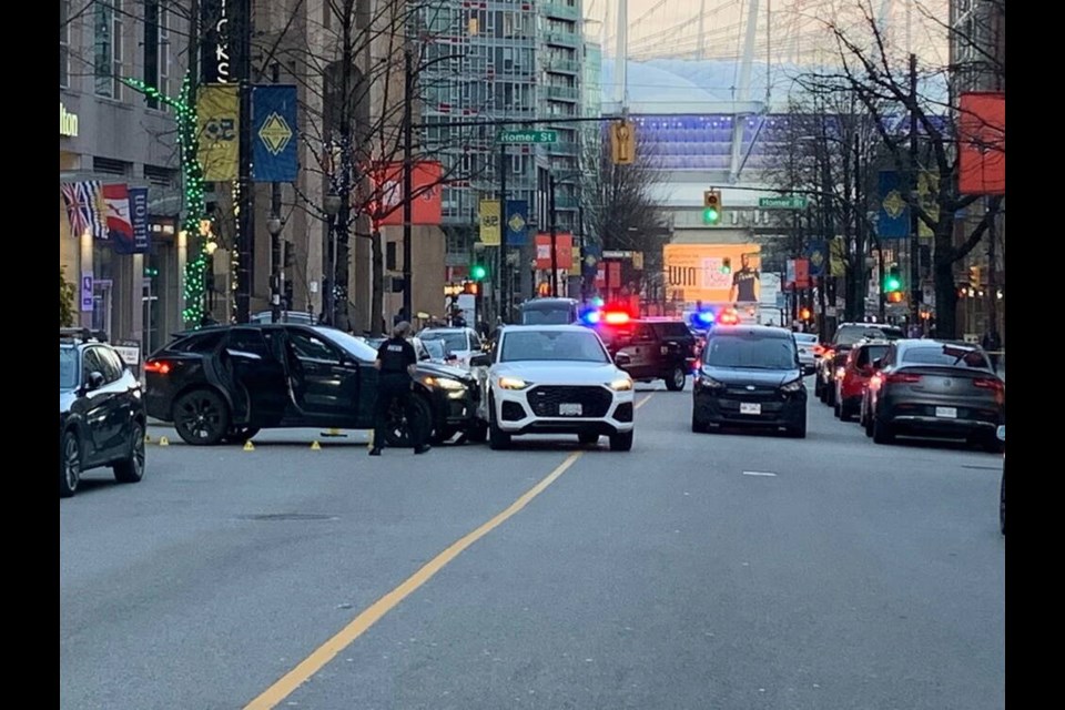 Vancouver police closed off Robson between Homer and Richards streets Saturday evening following a targeted shooting. Douglas Quan, Postmedia 
