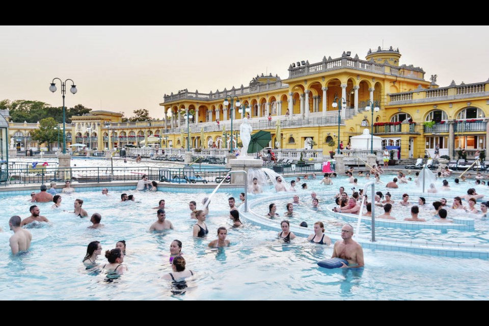 Hungarian bathers enjoying the outdoor hot-water pools of the Széchenyi Baths in Budapest Budapest’s baths are fun and relaxing — BYO swimsuit and towel. CAMERON HEWITT 