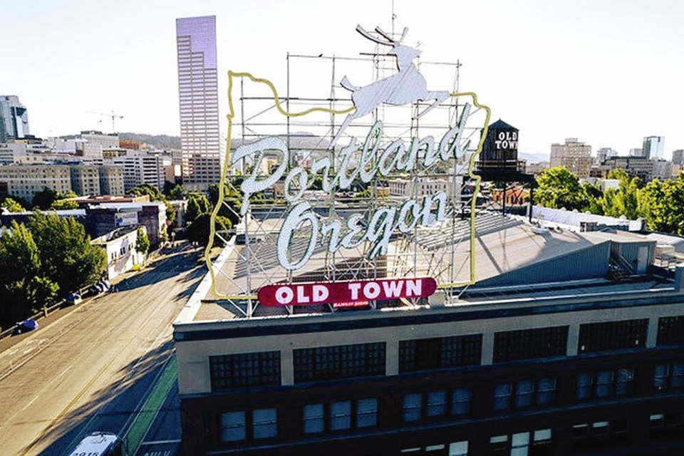 The landmark Portland Oregon sign welcoming visitors to the city’s downtown. (photo credit: Justin Katigbak) 
