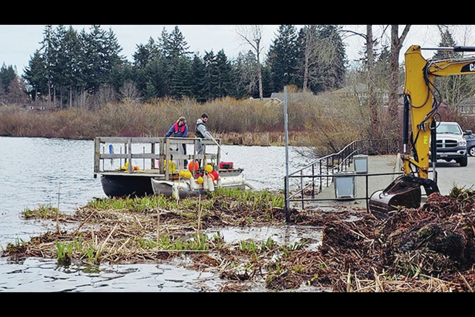 Crews on the lake and shoreline breakup and removed the ‘rogue island’ of Quamichan Lake, near Duncan. DISTRICT OF NORTH COWICHAN 