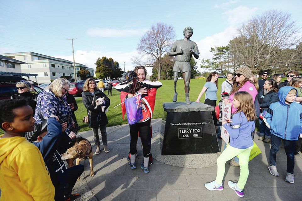New Zealander Jon Nabbs, who ran across Canada solo and without a support crew as a fundraiser for childhood cancer research, finishes his journey at the Terry Fox statue and Mile Zero on Saturday, March 2, 2024. ADRIAN LAM, TIMES COLONIST 