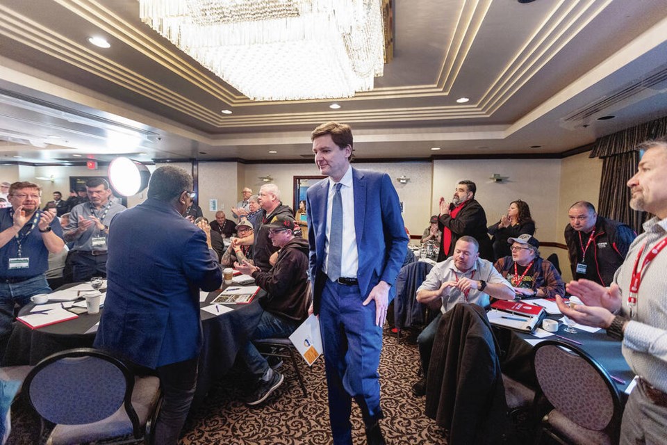Premier David Eby speaks at a summit jointly hosted by Unifor, the United Steelworkers and the Public and Private Workers of Canada at the Coast Victoria Hotel on Tuesday. DARREN STONE, TIMES COLONIST 