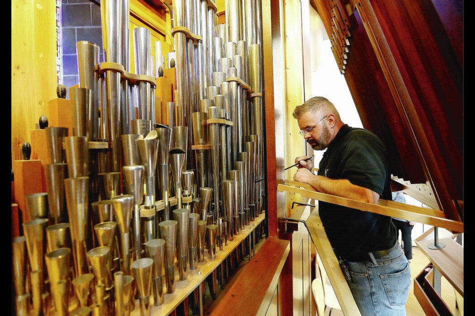Organ tuner Jason Barnsley works on Christ Church Cathedral’s Hellmuth Wolff organ in 2018. The organ is part of Organ Crawl, a walking tour in Victoria on Saturday, April 20.	ADRIAN LAM, TIMES COLONIST 