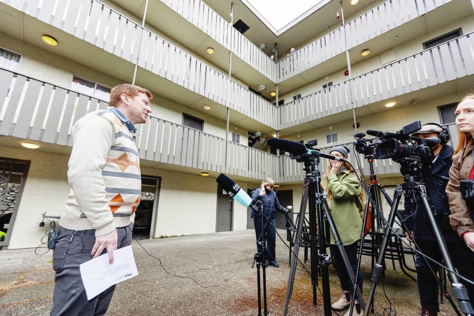 Together Against Poverty Society lawyer Douglas King talks to the media in the courtyard at the Sturdee Street Apartments after the entire apartment building was served an eviction notice for renovations. DARREN STONE, TIMES COLONIST 