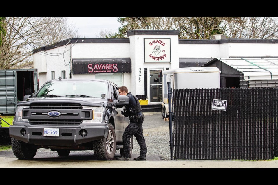 Police execute a search warrant at Savages Motorcycle Club on Spencer Road on Jan. 31. DARREN STONE, TIMES COLONIST 