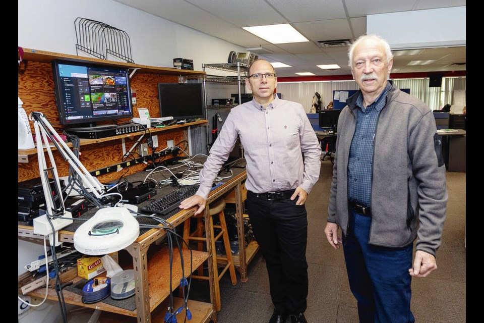 Ed Life, right, who created and incorporated Tecnet Canada Inc. in 1974, recently sold his company to his Operations Manager, Matt Van Heyst, who worked at Tecnet for 24 years. DARREN STONE, TIMES COLONIST 