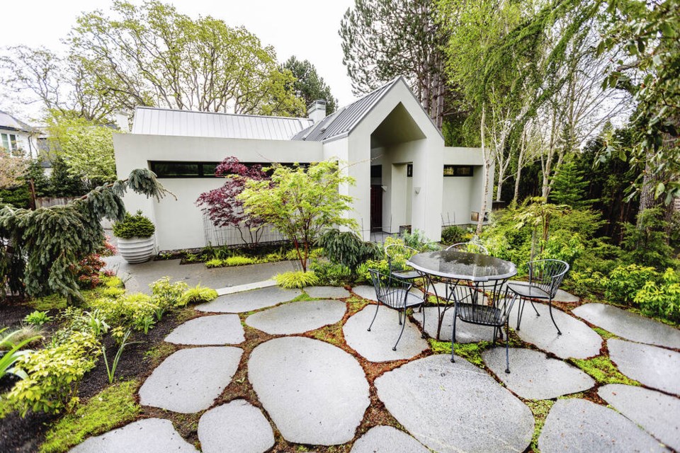 Enormous pavers create a appealing and spacious patio for entertaining while providing plenty of stability for table and chairs at this home that will be part of this year’s Victoria Conservatory of Music Garden Tour.	DARREN STONE, TIMES COLONIST 