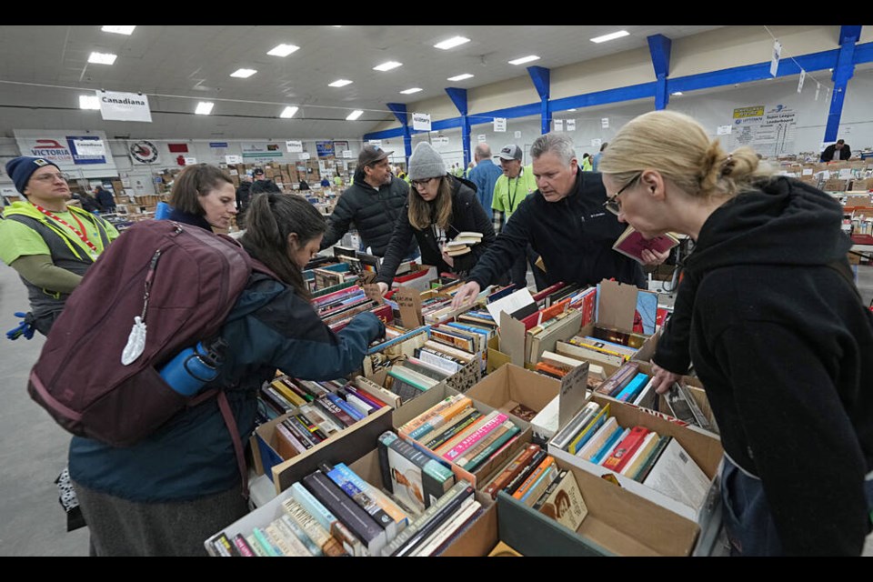 People shop for books at the annual Times Colonist Book Sale at the Victoria Curling Club on Saturday. ADRIAN LAM, TIMES COLONIST 