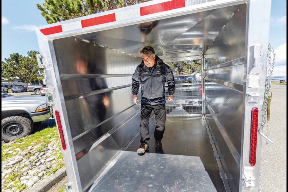 Paul Cottrell, marine mammal co-ordinator for Fisheries and Oceans Canada, checks out the interior of a shiny new trailer dubbed Emerson’s Chariot at Oak Bay Marina on Tuesday. DARREN STONE, TIMES COLONIST 