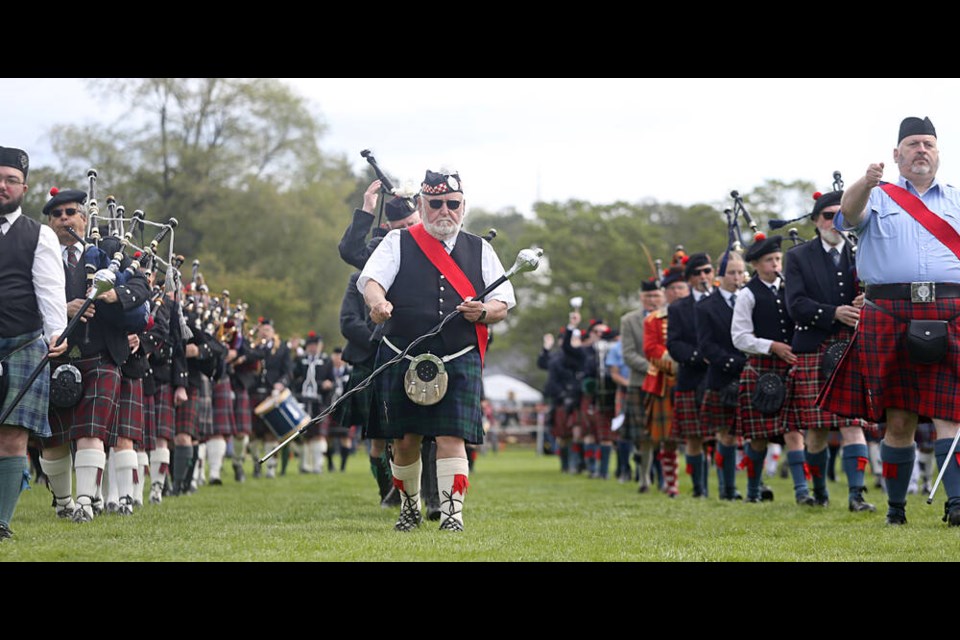 A mass pipes and drums contingent performs at the opening ceremonies for the 161st Victoria Highland Games and Celtic Festival at Topaz Park in Victoria on Saturday. ADRIAN LAM, TIMES COLONIST. May 18, 2024 