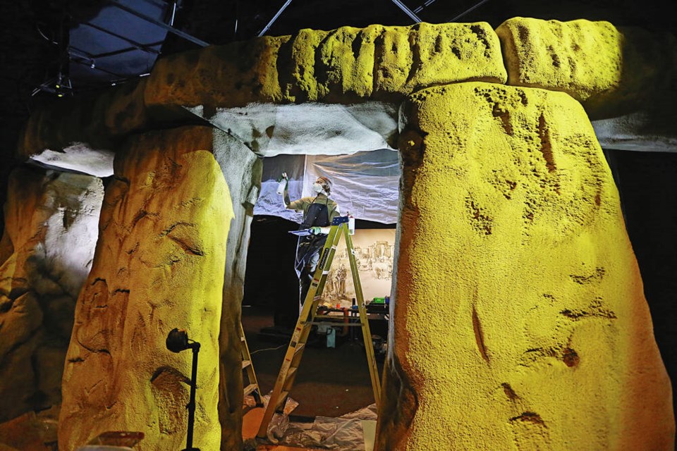 Devin Hobbins, exhibit fabrication specialist, works on the entrance columns for the new Stonehenge exhibit at the Royal B.C. Museum. ADRIAN LAM, TIMES COLONIST 