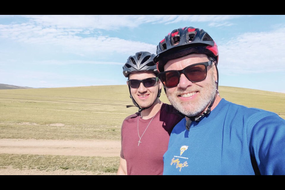 A happy morning cycling the endless Mongolian steppes, a few hours before James’s ­accident.  