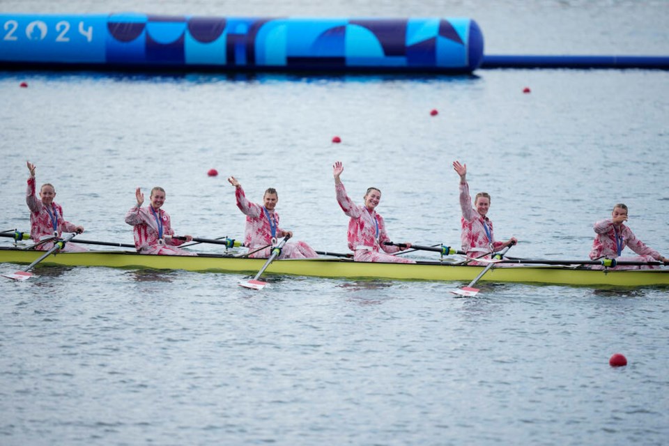 Members of Team Canada celebrate silver in the women's eight rowing final at the 2024 Summer Olympics, Saturday, Aug. 3, 2024, in Vaires-sur-Marne, France. (AP Photo/Ebrahim Noroozi)