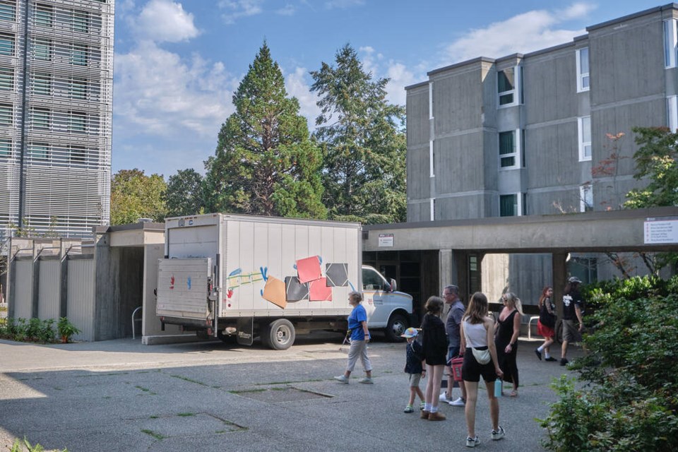 Families helping students move into University of Victoria residences on Sunday afternoon walk past a truck that was vandalized with pro-Palestinian and anti-UVic messaging. TIMES COLONIST. Sept. 1, 2024  