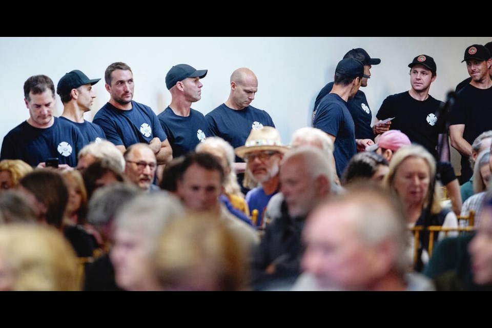About 60 off-duty Victoria firefighters attended the meeting about Dowler Place on Tuesday. DARREN STONE, TIMES COLONIST  