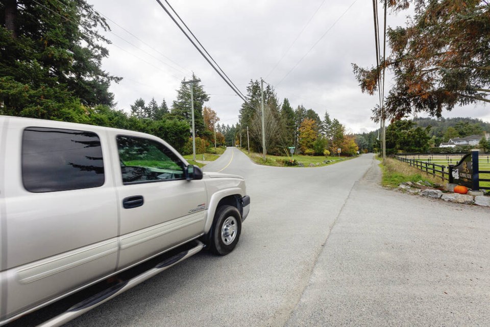 A truck travels near the scene of the fatal crash on Tanner Road at Central Saanich Road. DARREN STONE, TIMES COLONIST 