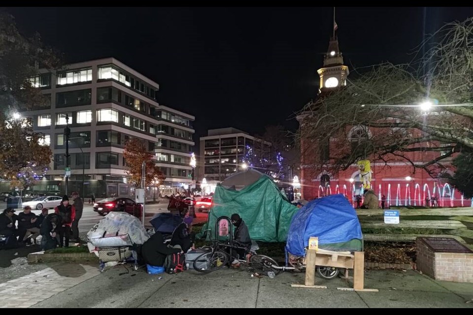 Four tents were set up on a grassy area of Centennial Square, next to Victoria City Hall, on Sunday. TIMES COLONIST 